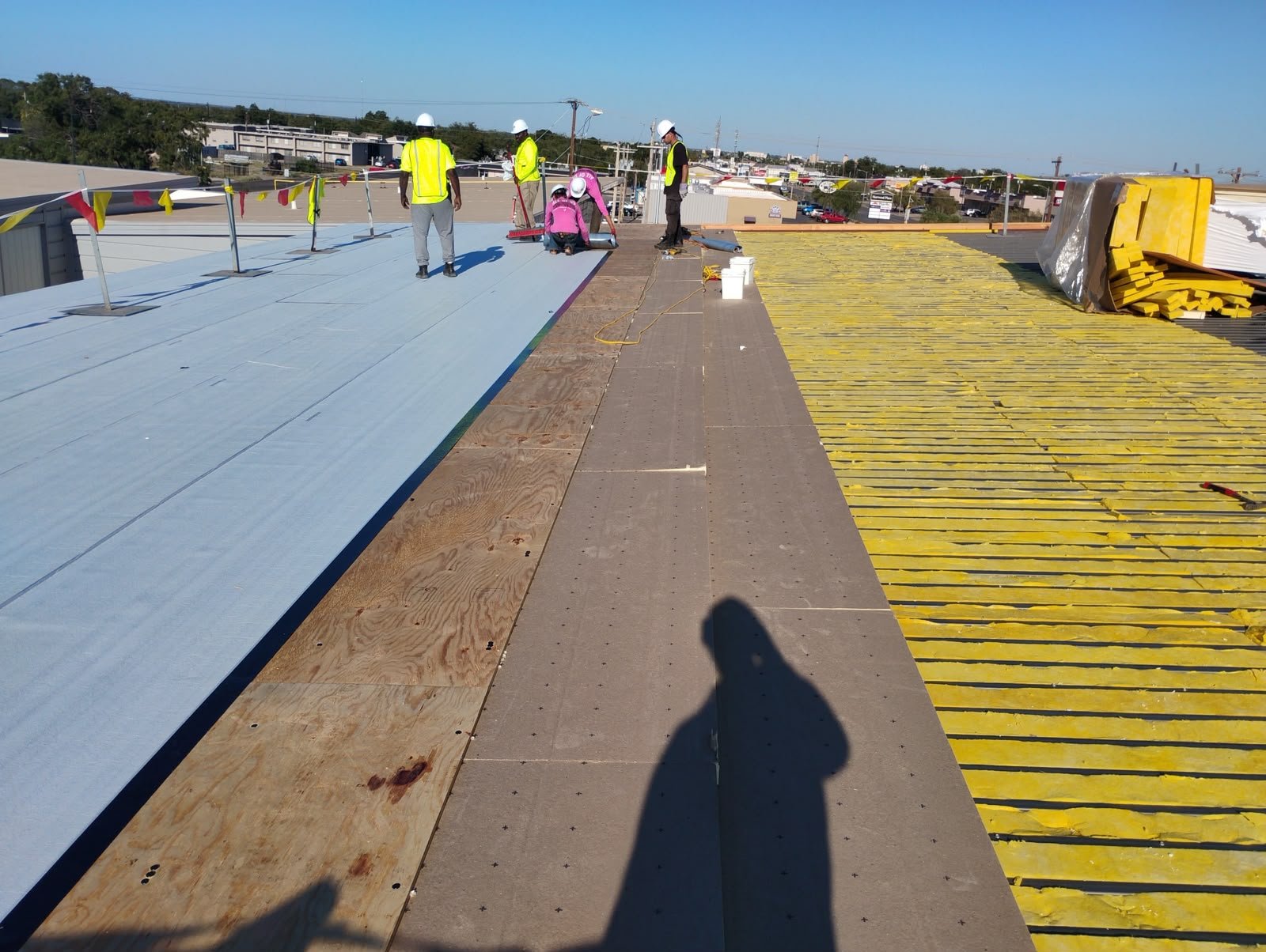 Legendary Construction roofing crew at work on a commercial roof installation